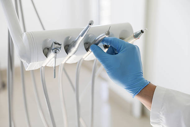 Professional Tooth Extraction technician working in Newton, MA